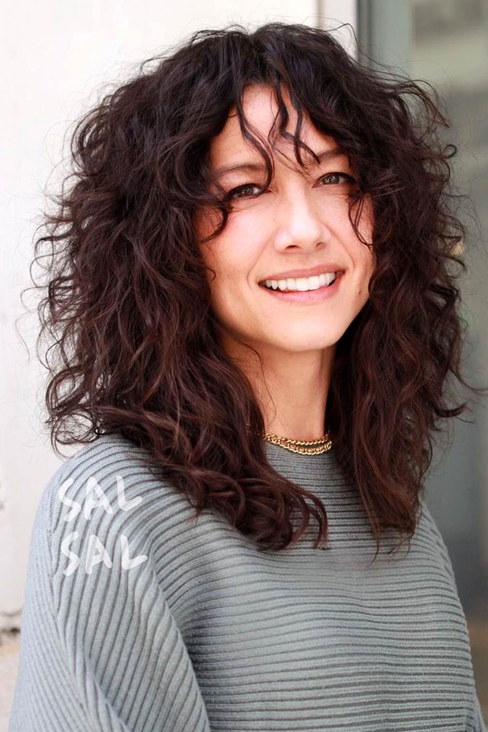 Curly Hair with Curtain Bangs