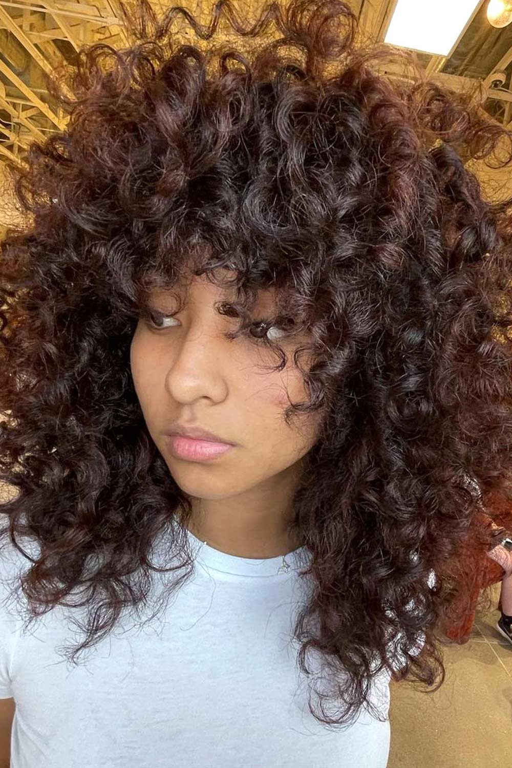 Layered Curly Hair with Bangs