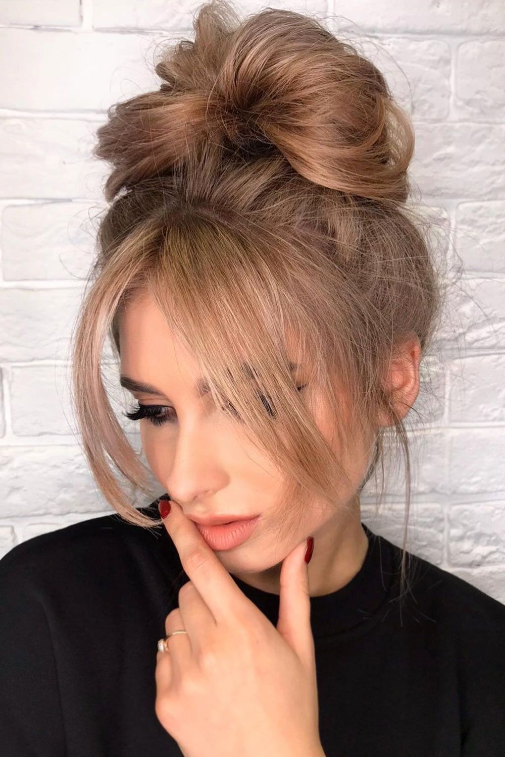 Long Hair With Curtain Bangs in Messy Bun